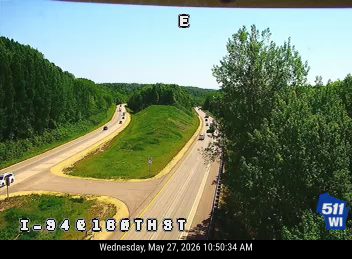 White SUV on the left shoulder near the sign post