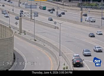 Emergency vehicle on the right shoulder of I-94 at 84th Street.