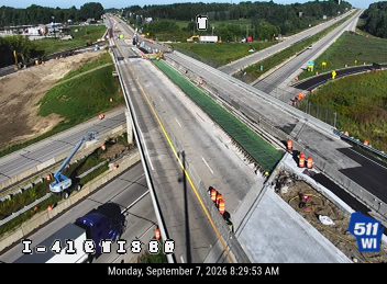 Construction cones and workers on the roadway