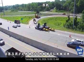 Construction cones and workers in the right lane
