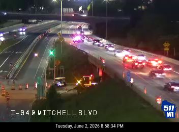 Emergency vehicles and traffic backup on I-94 at Mitchell Blvd.