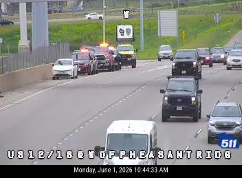 Emergency responders with lights on are present on the roadway.