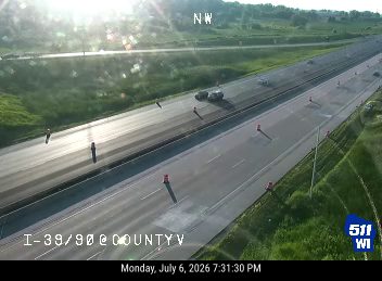 Construction cones and workers in the right lane