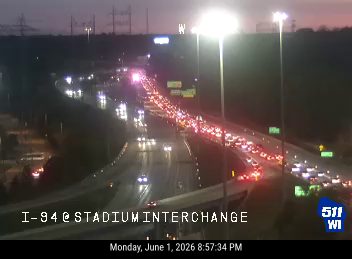 Emergency vehicles and heavy traffic congestion at I-94 Stadium Interchange.