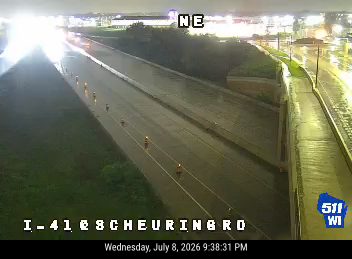 Construction cones and a worker in the right lane