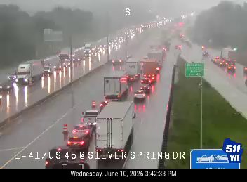 Multi-vehicle crash on I-41/US 45 at Silver Spring Dr during heavy rain.