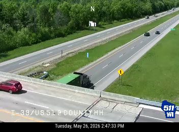 A truck appears to have lost its load, spilling debris onto the roadway.