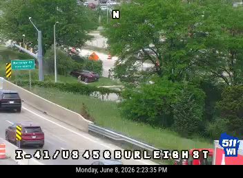 A car appears to have gone off the road and crashed into the embankment.