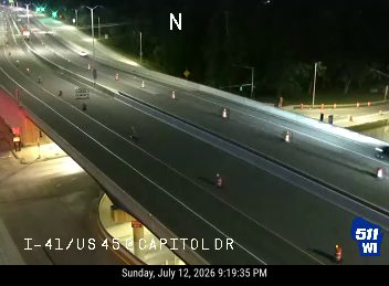 Construction cones and barrels in the left lane
