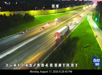 Construction cones and workers in the right lane