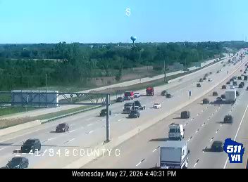 Emergency vehicles on the highway, possibly responding to an incident.