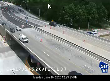 Construction cones and workers in the right lane