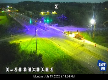 Construction equipment and workers in the roadway