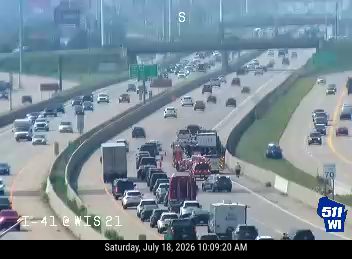 Fire truck and other emergency vehicles with lights on in the right lane