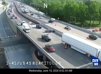 Two vehicles appear to be involved in a crash on the highway.