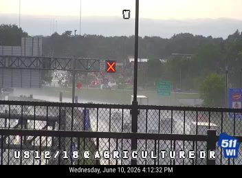 Emergency responders and vehicles on the highway, possibly at an incident scene.