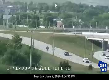 Two vehicles appear to be involved in a crash on the highway.