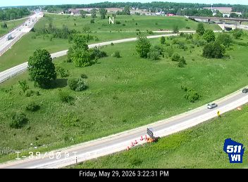 Debris and cones on the roadway, possibly from a vehicle incident.