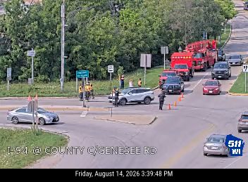Multiple emergency vehicles and personnel on the roadway