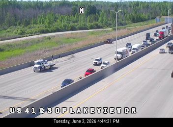 Large debris scattered across multiple lanes of highway.