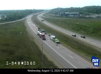 Construction cones and workers in the right lane