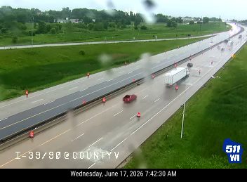 Construction cones and workers in the right lane