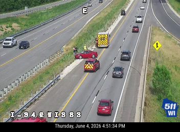 Fire truck and emergency vehicle on the shoulder of I-94.