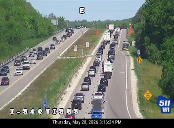 Multiple vehicles stopped in traffic, possible multi-vehicle crash ahead.