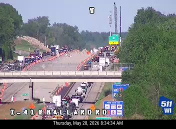 Multi-vehicle crash on I-41 at Ballard Rd, causing significant traffic backup.