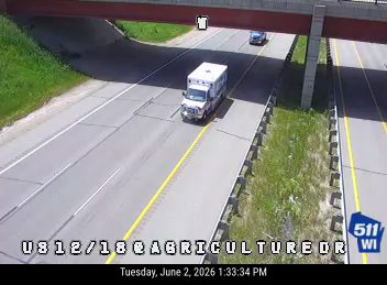 Ambulance on the highway, likely responding to an incident.