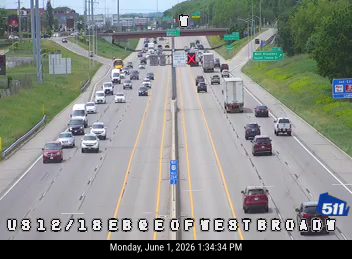 Multiple vehicles involved in a crash blocking lanes on the highway.