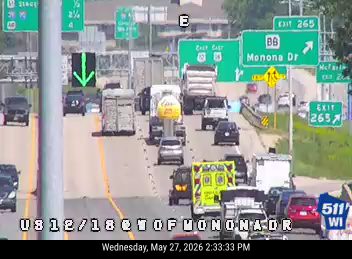 Ambulance and other vehicles on the roadway, possibly responding to an incident.
