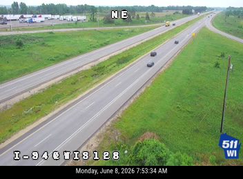 Several tires are scattered across the roadway, obstructing traffic.
