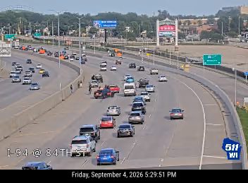 Person standing in the left lane