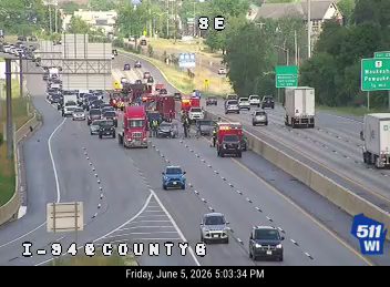 Emergency responders and vehicles are present on I-94 near County Road.