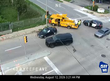 Police car and utility truck at intersection