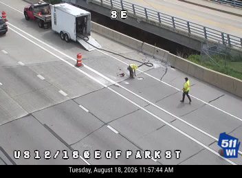 Construction cones and workers in the right lane