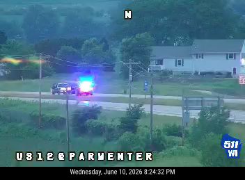 Police car with flashing lights on the side of the road.