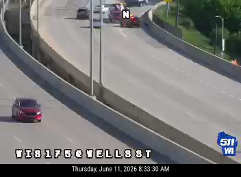 Multiple vehicles involved in a crash on a highway overpass.