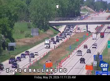 Emergency responders on the right shoulder with cones and equipment on I-41 at Ballard Road.
