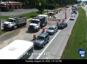 Construction cones and workers in the roadway