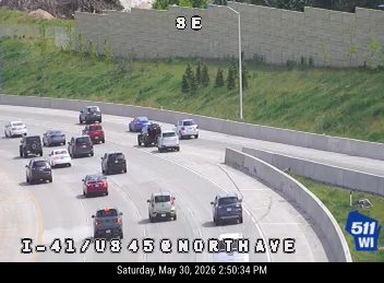 Two cars appear to be involved in a crash on the highway.