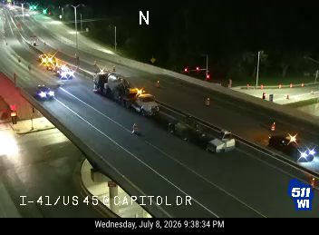 Construction cones and workers in the right lane