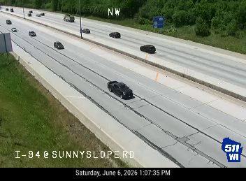 Two vehicles appear to be involved in a crash on the highway.