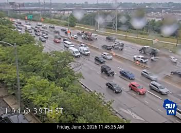 Emergency vehicles and personnel appear to be responding to an incident on the highway.