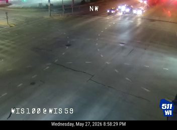 Emergency vehicles with lights on at intersection, likely responding to an incident.
