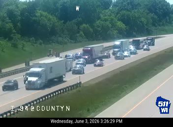 Multiple vehicles stopped on highway, appears to be a multi-vehicle accident.