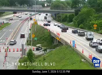 Emergency responders and cones on the roadway, indicating an incident.