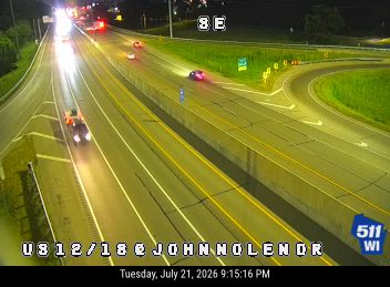 Vehicle with red and blue flashing lights on the right shoulder