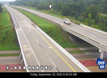 White truck with orange markings on the right shoulder